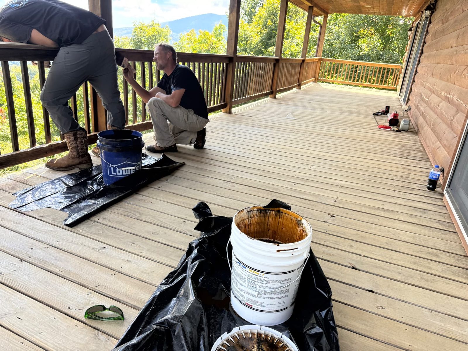 ProFlow crew prepping a deck for stain