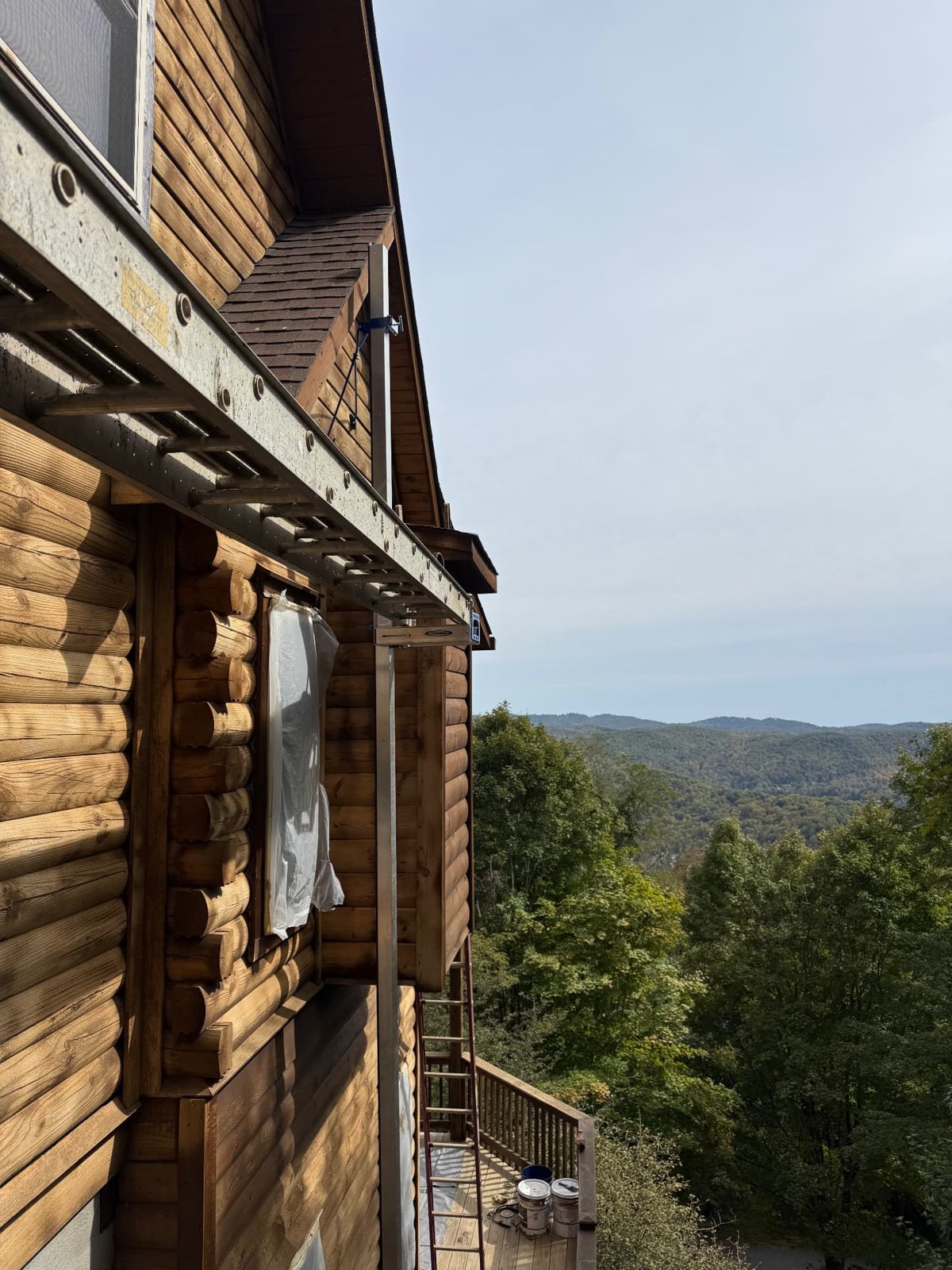 Log siding prepped for restoration